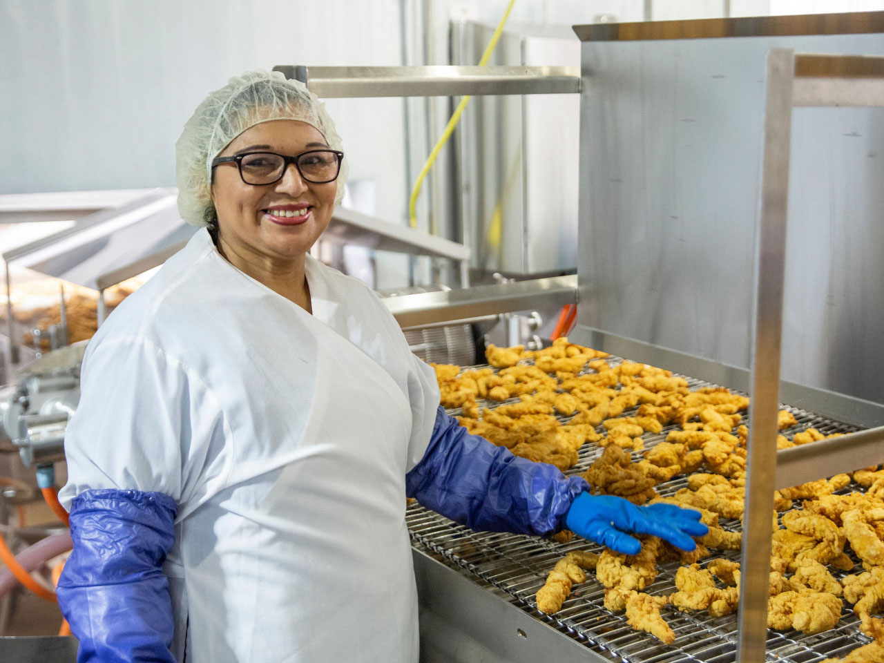 Production Chicken Quick This is a production worker smiling for a photo.