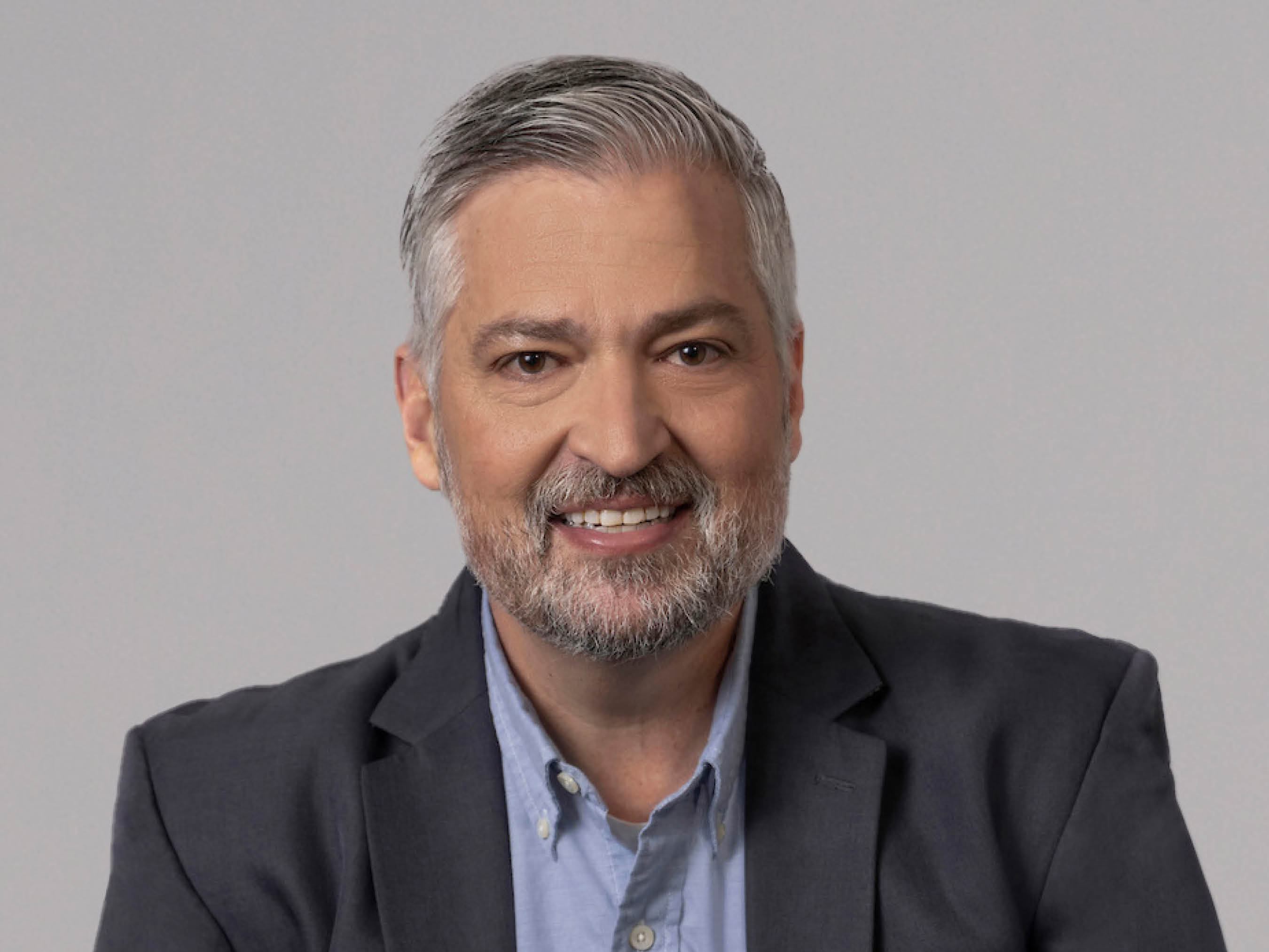 This is a headshot photo of Adam Deckinger.